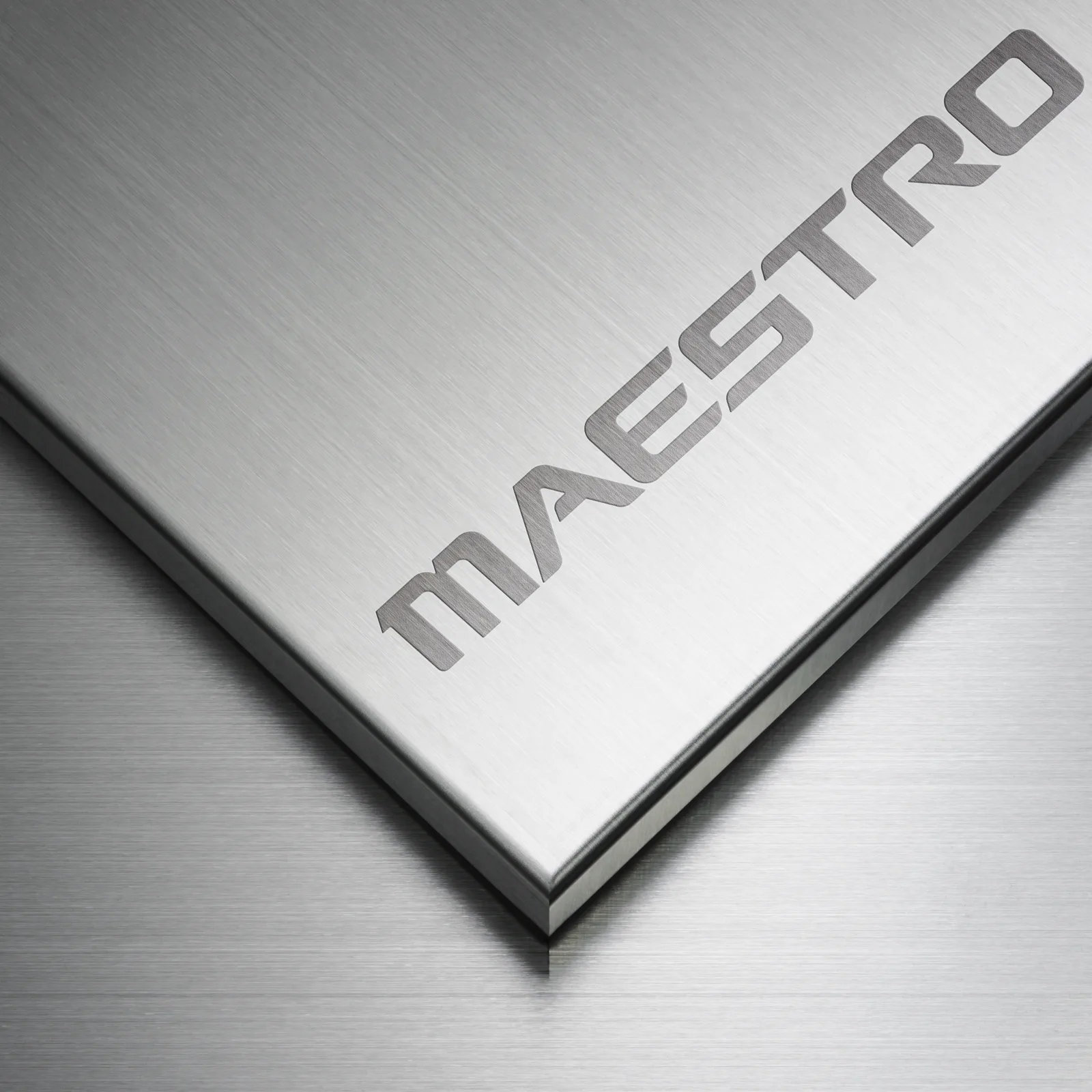 MAESTRO vehicle naming emblem engraved on a brushed metal surface